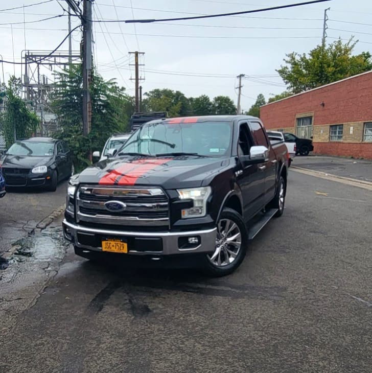Custom Stripe for Ford F150 using 3M Gloss Dragon Fire Red, side panels were repainted black after collision repair.